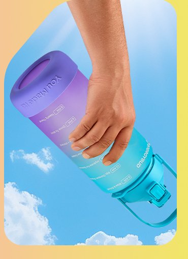 A hand tilting a sealed half gallon bottle sideways against a blue sky