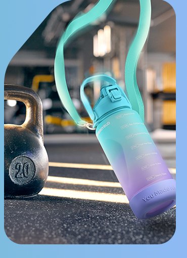 Half gallon bottle standing on a gym floor beside a kettlebell