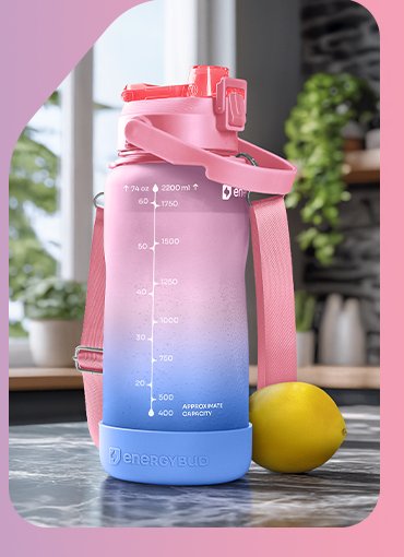Pink half gallon bottle on a kitchen counter beside a lemon